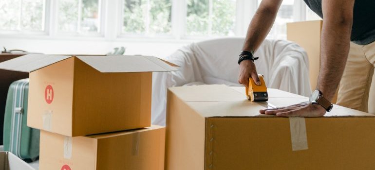 Man taping boxes